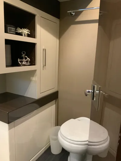  Yacht Photos Pics Modern bathroom in 2018 Carver C52 Coupe yacht with sleek cabinetry and toilet.