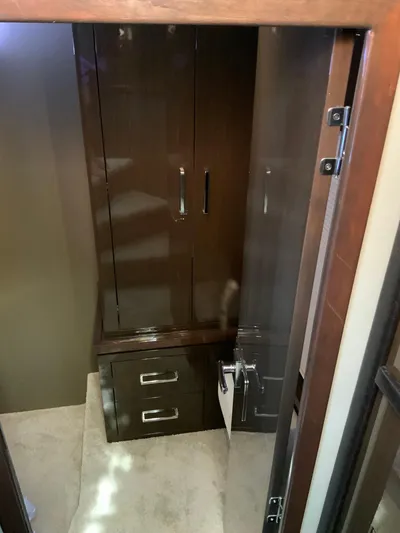  Yacht Photos Pics 2018 Carver C52 Coupe interior with sleek wooden cabinetry and modern design.