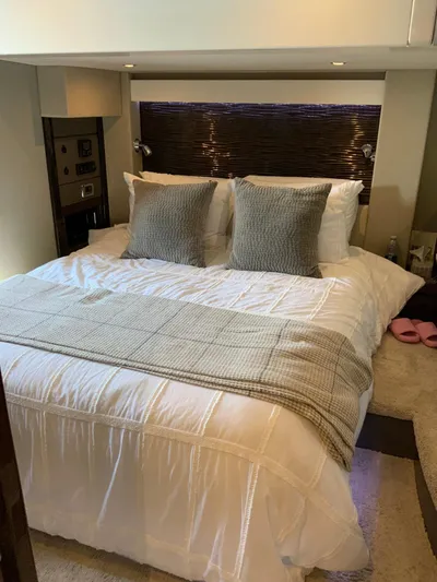  Yacht Photos Pics Luxurious bedroom interior of 2018 Carver C52 Coupe yacht with elegant bedding.