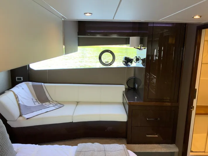  Yacht Photos Pics Luxurious interior of 2018 Carver C52 Coupe yacht with elegant seating and cabinetry.