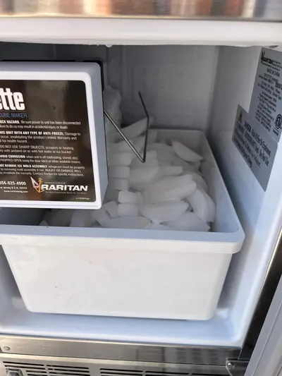  Yacht Photos Pics Ice maker in a Carver C52 Coupe yacht, filled with ice cubes.