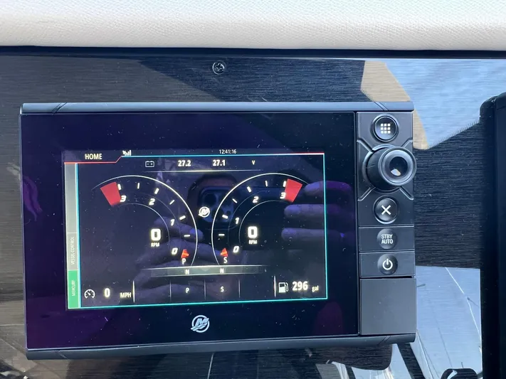  Yacht Photos Pics Dashboard display of a 2018 Carver C52 Coupe showing speed and RPM gauges.