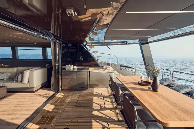  Yacht Photos Pics Luxurious Sunreef 60 Power yacht interior, featuring elegant dining area and ocean view, 2026 model.