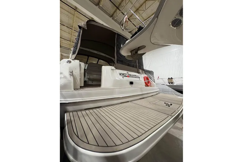 Knot Squared II Yacht Photos Pics 1999 Sea Ray 400 Sundancer yacht in storage, showcasing spacious deck and sleek design.