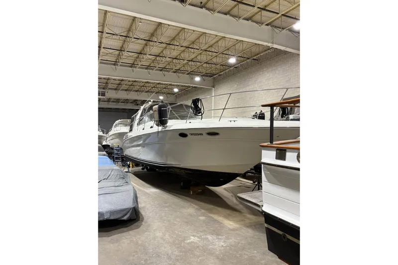Knot Squared II Yacht Photos Pics 1999 Sea Ray 400 Sundancer yacht in indoor storage facility.