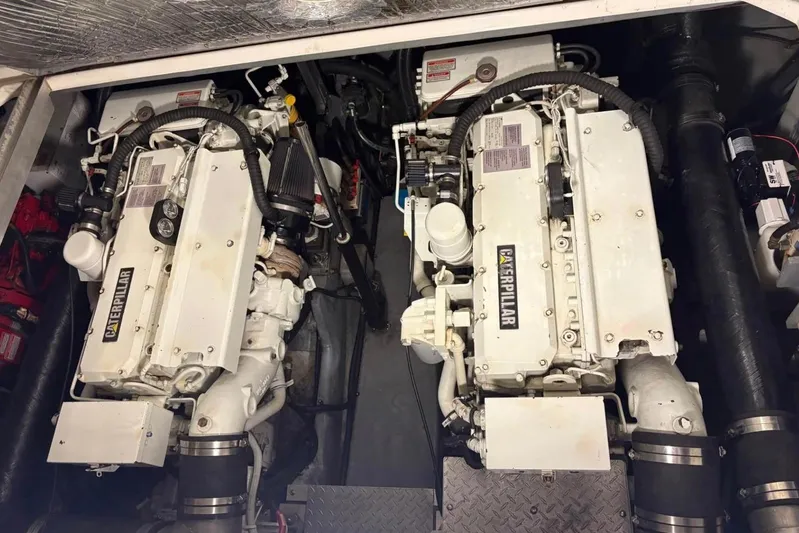 Knot Squared II Yacht Photos Pics Engine room of 1999 Sea Ray 400 Sundancer with twin Caterpillar engines.