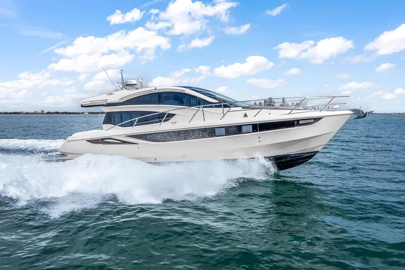  Yacht Photos Pics 2018 Galeon 430 HTC yacht cruising on open water under a clear blue sky.
