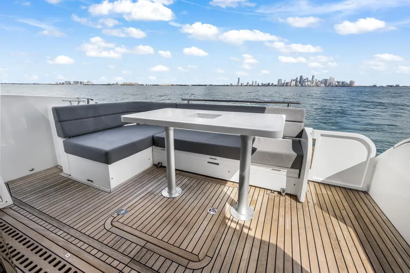  Yacht Photos Pics 2018 Galeon 430 HTC yacht deck with seating, table, and ocean view.