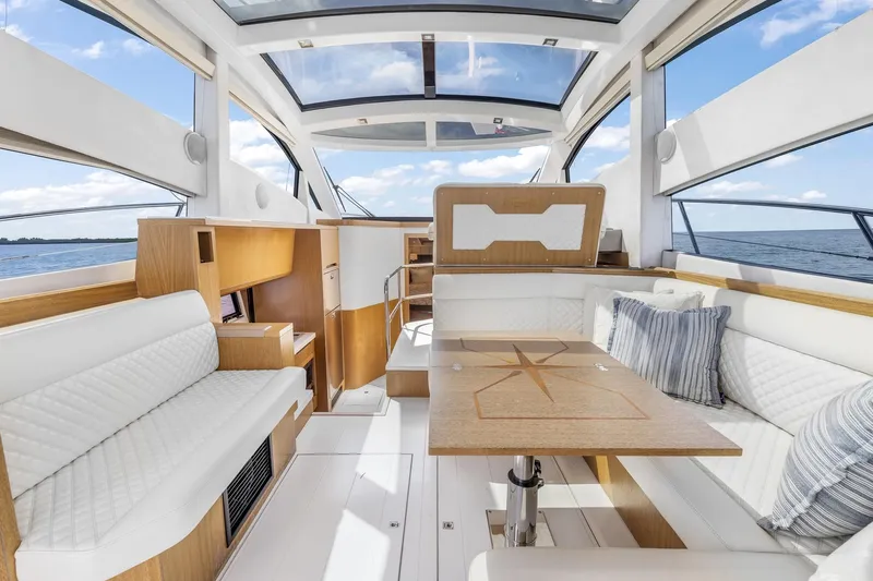  Yacht Photos Pics Luxurious interior of 2018 Galeon 430 HTC yacht with elegant seating and wooden table.