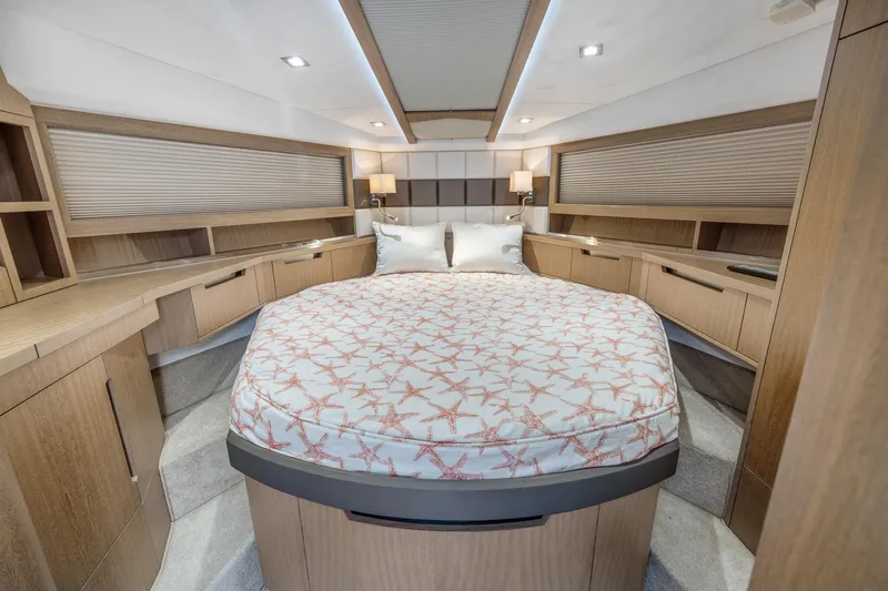  Yacht Photos Pics Luxurious 2018 Galeon 430 HTC yacht bedroom with elegant wood finishes and starfish-patterned bedding.
