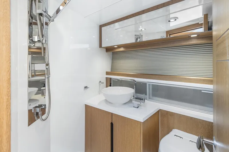  Yacht Photos Pics Modern bathroom interior on 2018 Galeon 430 HTC yacht, featuring sleek fixtures and wood accents.