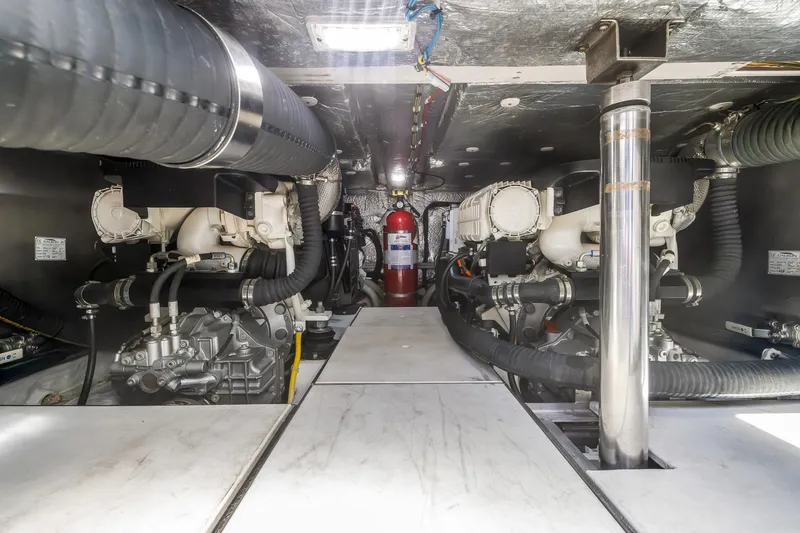  Yacht Photos Pics Engine room of 2018 Galeon 430 HTC yacht, showcasing mechanical components and fire extinguisher.