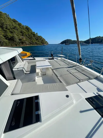  Yacht Photos Pics Modern Bali 4.8 catamaran, 2021 model, with spacious deck, sailing in scenic coastal waters.