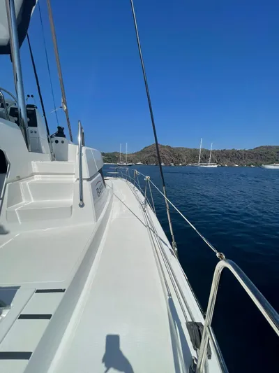  Yacht Photos Pics 2021 Bali 4.8 yacht on calm blue water with clear sky.