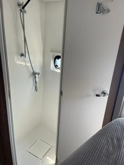  Yacht Photos Pics Shower area in a 2021 Bali 4.8 yacht, featuring sleek design and modern fixtures.