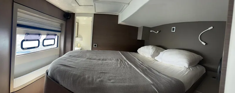  Yacht Photos Pics Cozy bedroom interior on 2021 Bali 4.8 yacht with window view.