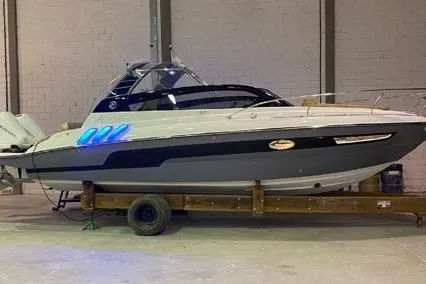  Yacht Photos Pics 2024 Hanover 305 White & Gray Edition boat in warehouse, side view with blue lighting.