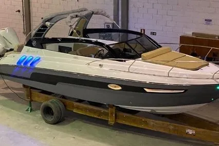  Yacht Photos Pics 2024 Hanover 305 White & Gray Edition boat in a warehouse setting.