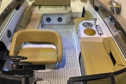  Yacht Photos Pics 2024 Hanover 305 White & Gray Edition boat interior with beige seating and modern amenities.