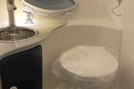  Yacht Photos Pics 2024 Hanover 305 White & Gray Edition bathroom with sink and toilet, modern design.