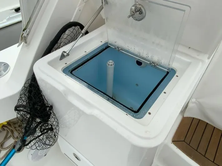 Salty Bear Yacht Photos Pics Livewell on 2022 Albemarle 360 Express Fisherman boat, featuring fishing net and storage.