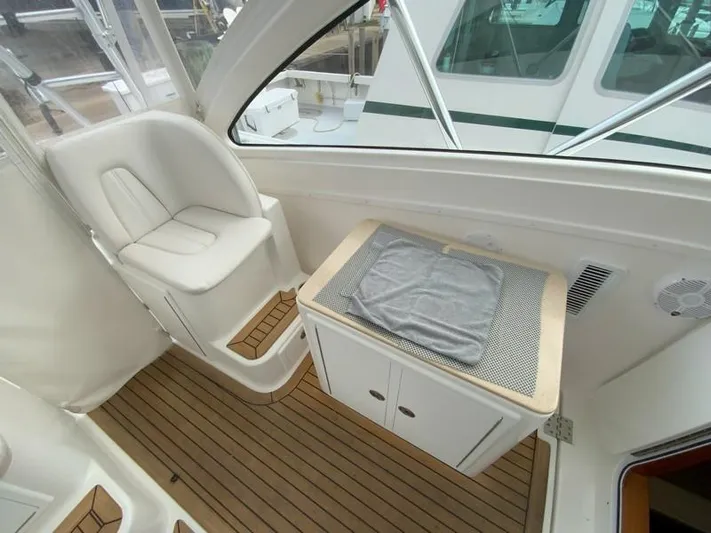 Salty Bear Yacht Photos Pics 2022 Albemarle 360 Express Fisherman interior with seating and storage on teak flooring.