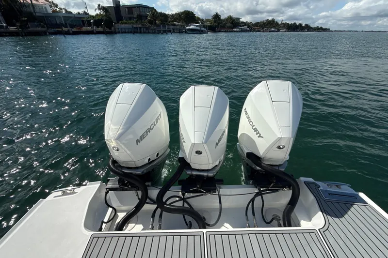  Yacht Photos Pics 2019 Monterey 385 Super Express with triple Mercury outboard engines on a sunny day.