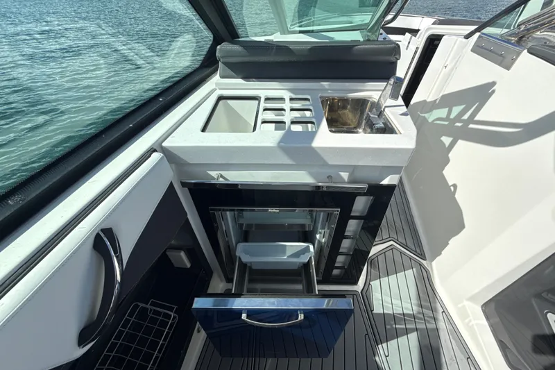  Yacht Photos Pics 2019 Monterey 385 Super Express boat interior with kitchenette and sink.