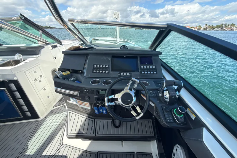  Yacht Photos Pics Cockpit of 2019 Monterey 385 Super Express boat with modern controls and steering wheel.