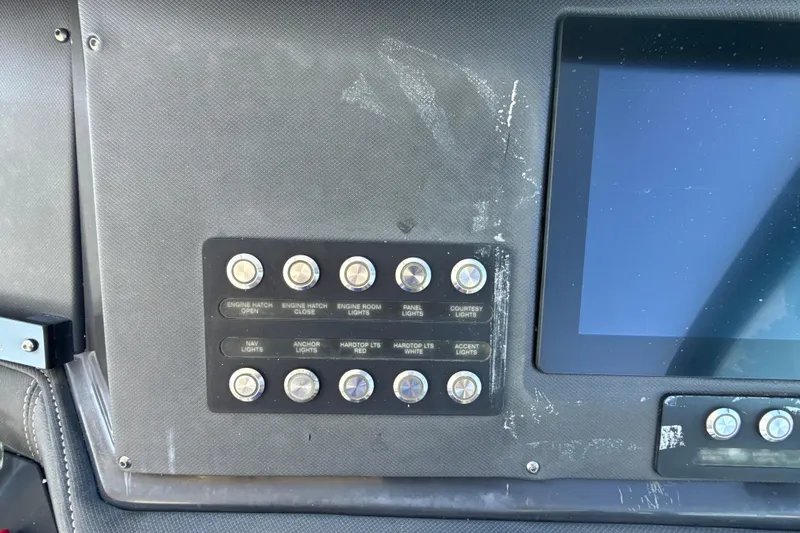  Yacht Photos Pics Control panel of a 2019 Monterey 385 Super Express boat with labeled switches.
