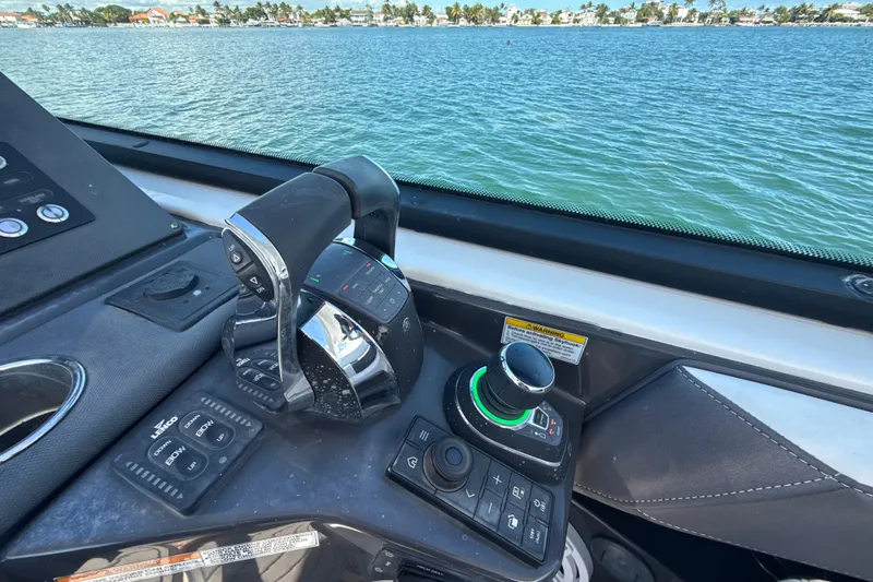  Yacht Photos Pics Control panel of a 2019 Monterey 385 Super Express boat with water view.