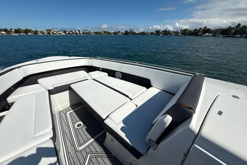  Yacht Photos Pics 2019 Monterey 385 Super Express boat with spacious seating on calm waters.
