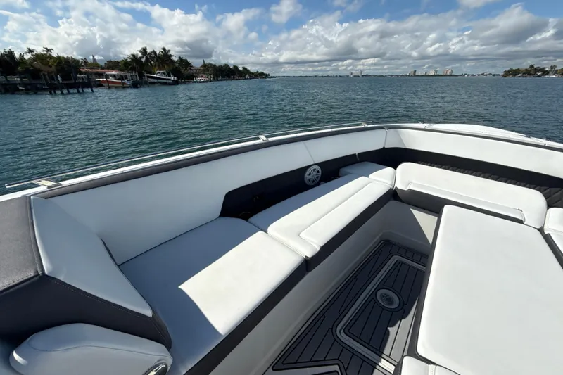  Yacht Photos Pics 2019 Monterey 385 Super Express boat interior with white seating, overlooking calm waters.