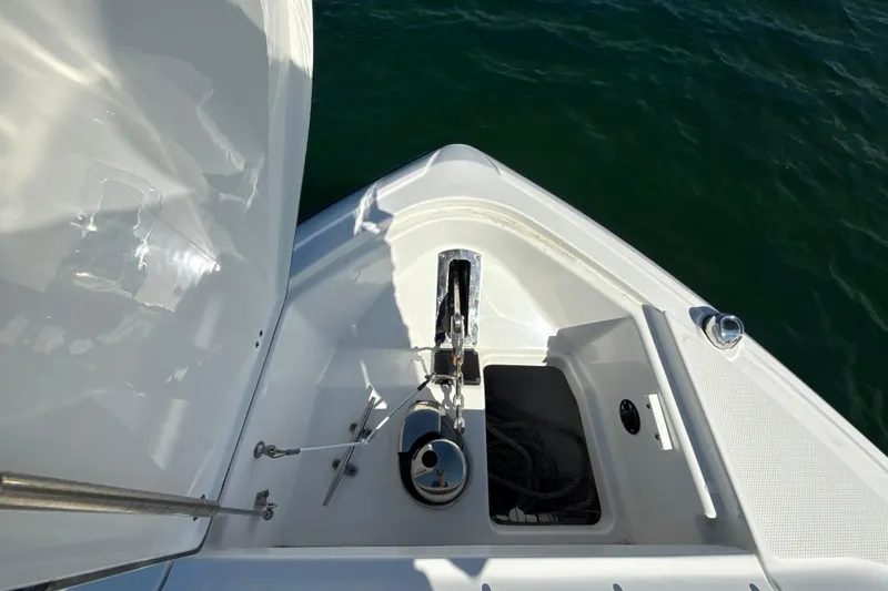  Yacht Photos Pics Bow view of 2019 Monterey 385 Super Express yacht with anchor and storage compartment.