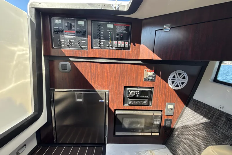  Yacht Photos Pics Control panel and appliances inside a 2019 Monterey 385 Super Express boat cabin.