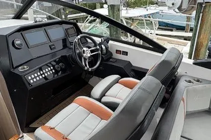  Yacht Photos Pics 2023 Hanover 377 boat cockpit with modern controls and dual seating.