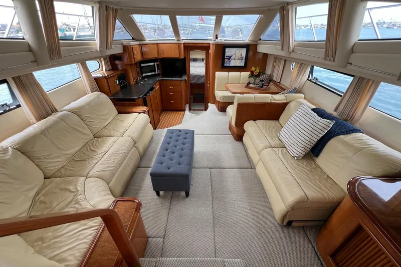  Yacht Photos Pics Luxurious interior of 2003 Carver 444 Cockpit Motor Yacht with leather seating and panoramic windows.