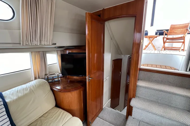  Yacht Photos Pics Interior of 2003 Carver 444 Cockpit Motor Yacht with cozy seating and TV.