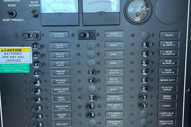  Yacht Photos Pics Control panel of a 2003 Carver 444 Cockpit Motor Yacht with labeled switches and gauges.