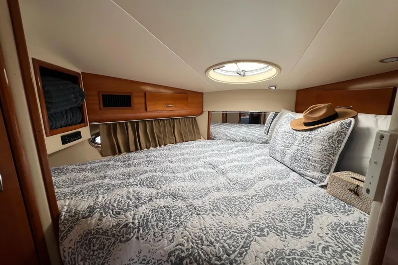  Yacht Photos Pics Luxurious cabin interior of 2003 Carver 444 Cockpit Motor Yacht with elegant bedding.