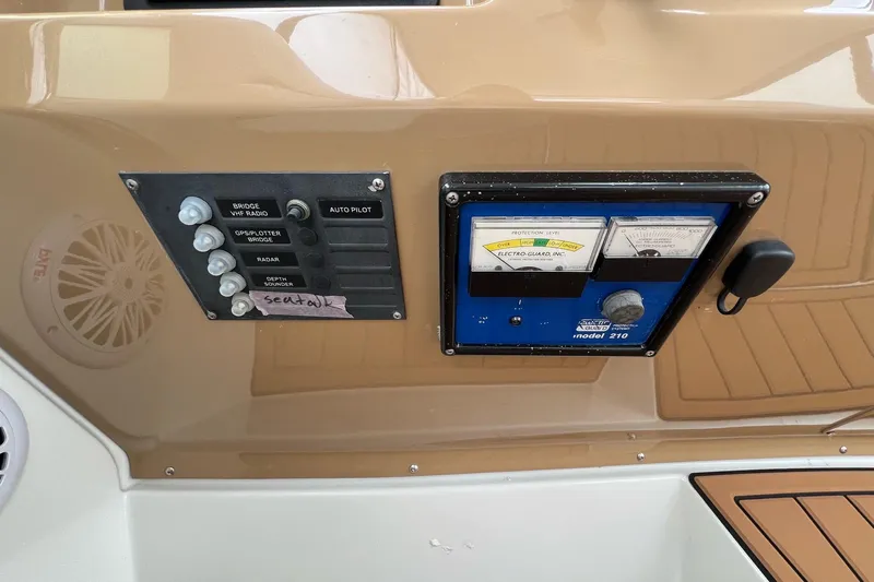  Yacht Photos Pics Control panel of a 2003 Carver 444 Cockpit Motor Yacht with switches and gauges.