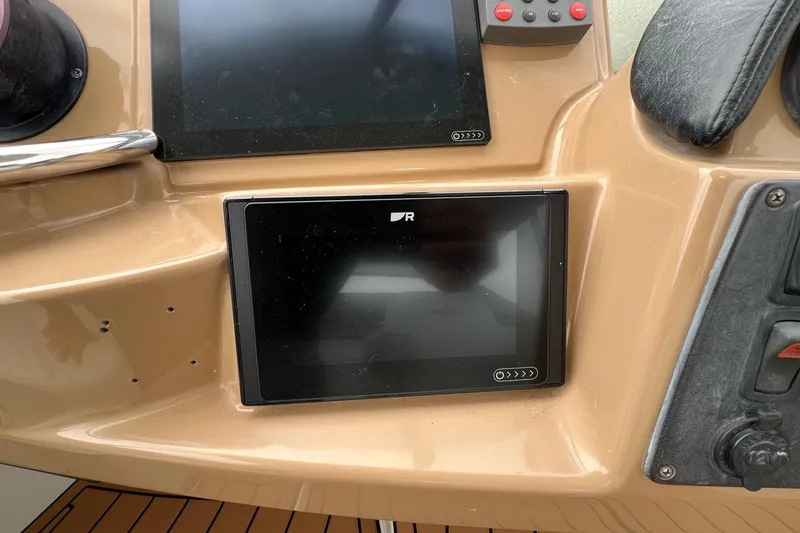  Yacht Photos Pics Dashboard of 2003 Carver 444 Cockpit Motor Yacht with electronic display and controls.