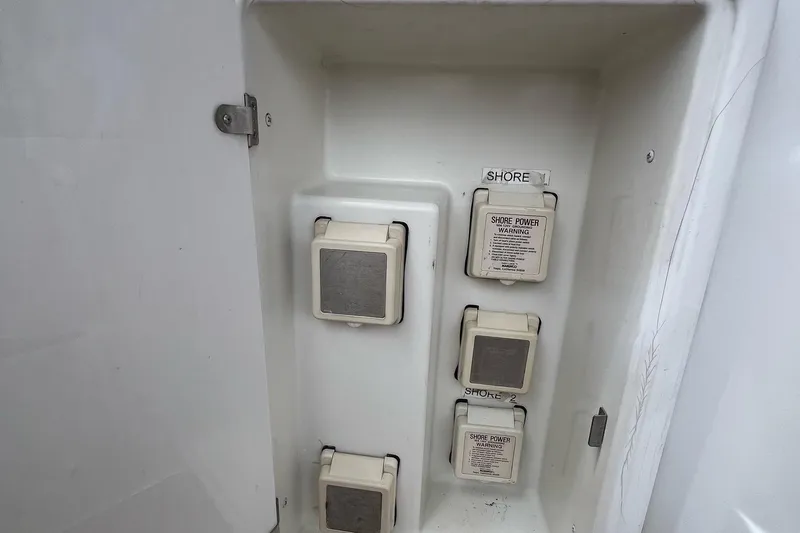  Yacht Photos Pics Electrical panel on a 2003 Carver 444 Cockpit Motor Yacht, featuring shore power connections.