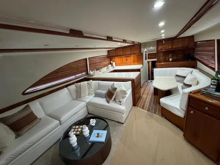  Yacht Photos Pics Luxurious interior of a 2004 Bertram 510 Convertible yacht with elegant seating and wood finishes.