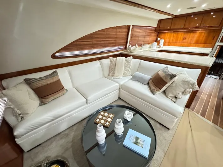  Yacht Photos Pics Luxurious interior of a 2004 Bertram 510 Convertible yacht with white sofa and elegant decor.