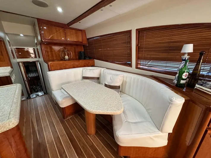  Yacht Photos Pics Luxurious interior of 2004 Bertram 510 Convertible yacht with elegant dining area.