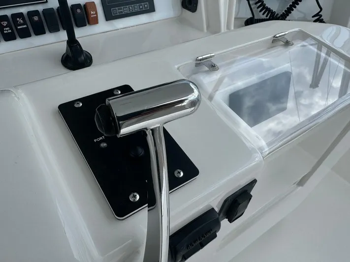  Yacht Photos Pics Close-up of 2004 Bertram 510 Convertible boat control panel and throttle lever.