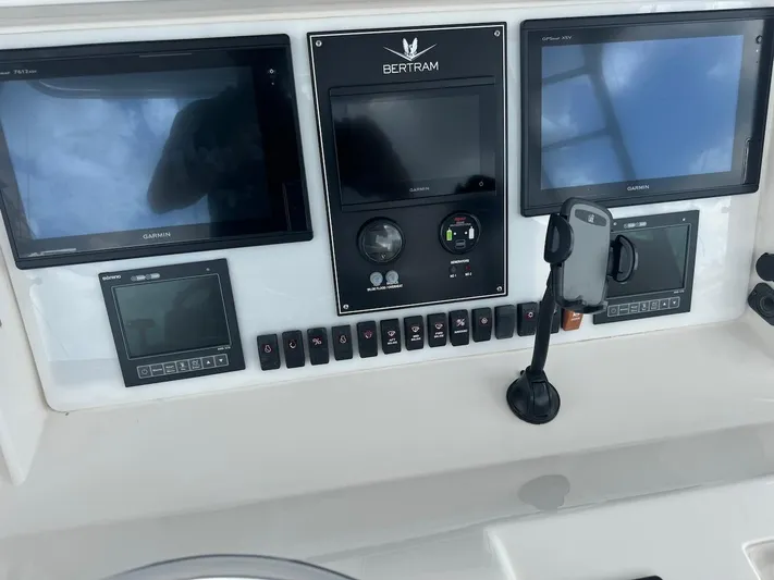  Yacht Photos Pics Control panel of 2004 Bertram 510 Convertible with Garmin displays and communication equipment.