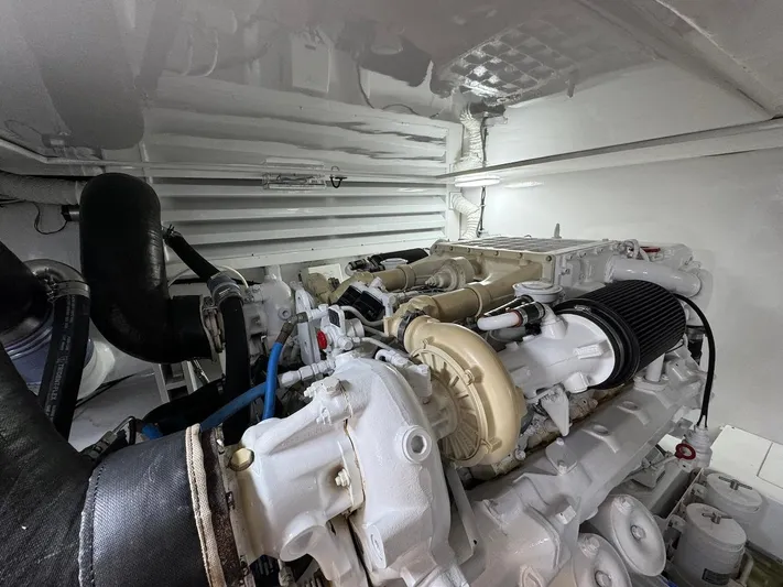  Yacht Photos Pics Engine room of 2004 Bertram 510 Convertible yacht, showcasing powerful marine engine.