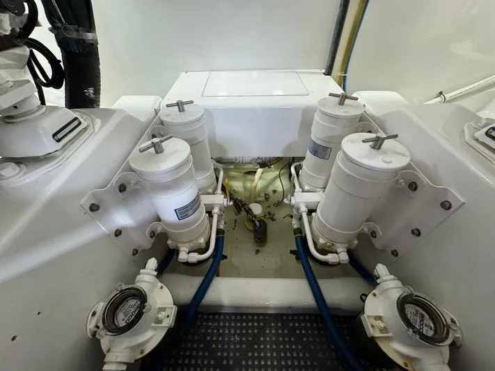  Yacht Photos Pics Engine room of 2004 Bertram 510 Convertible with fuel filters and hoses.